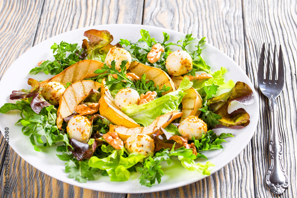 mozzarella, arugula, lettuce leaves and grilled pear salad mozzarella, arugula, lettuce leaves and grilled pear salad