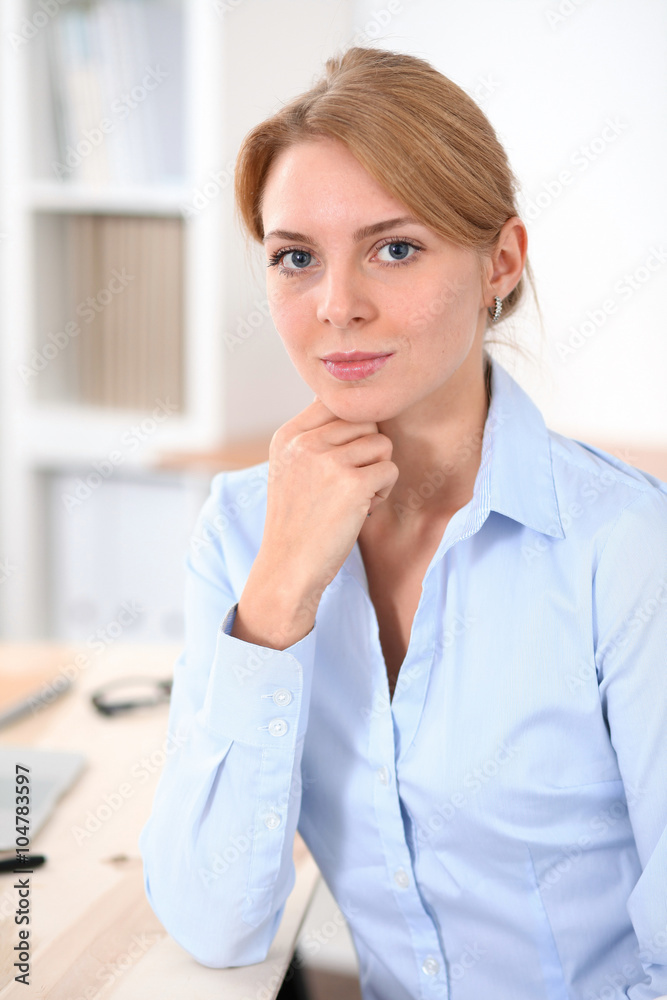 Young blonde business woman with laptop in the office. Business concept. Young blonde business woman with laptop in the office. Business concept.