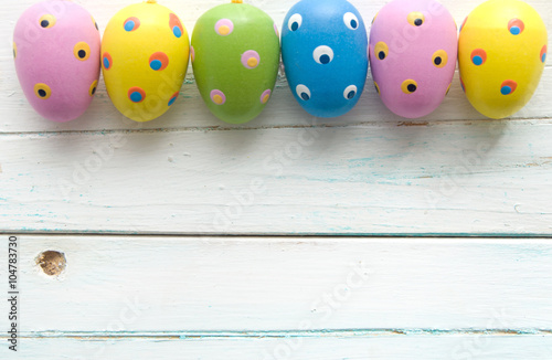 Easter eggs on wooden backg...