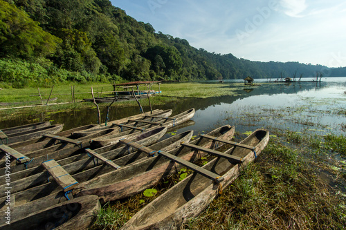 traditional boat park at tamblingan lake, bali island indonesia photo