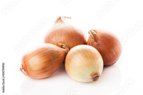 onion bulbs isolated on white background. Fresh golden onions