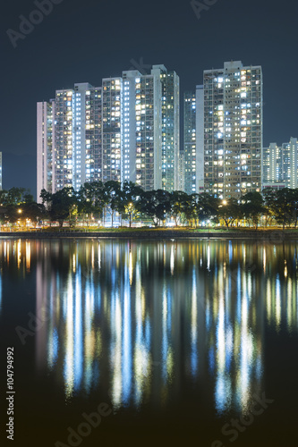 highrise Residential building in Hong Kong city at night © leeyiutung