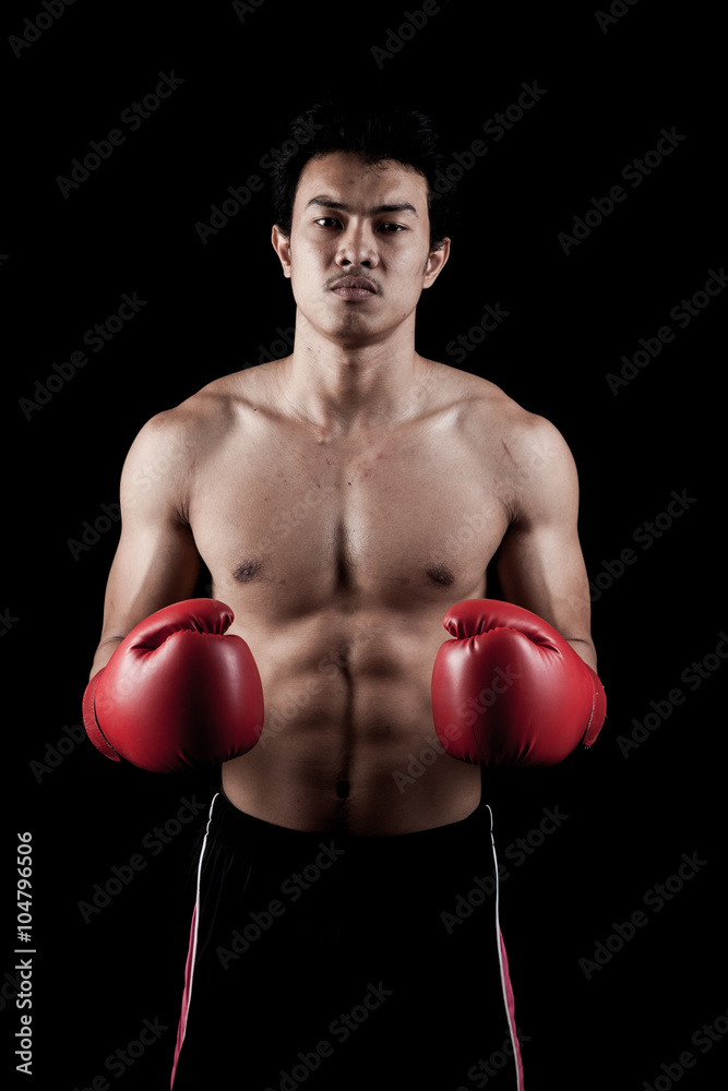 Muscular Asian man with red boxing glove Muscular Asian man with red boxing glove