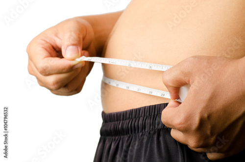 The man checking out of weight,holding measurement tape