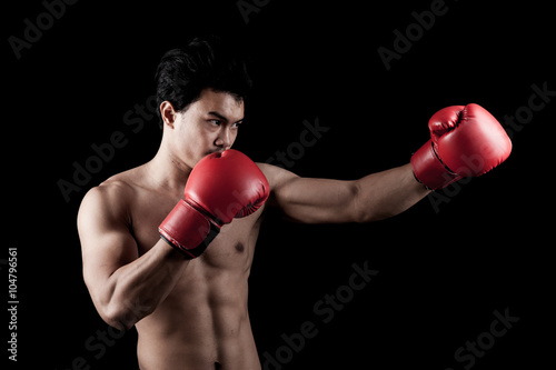 Muscular Asian man with red boxing glove © halfbottle