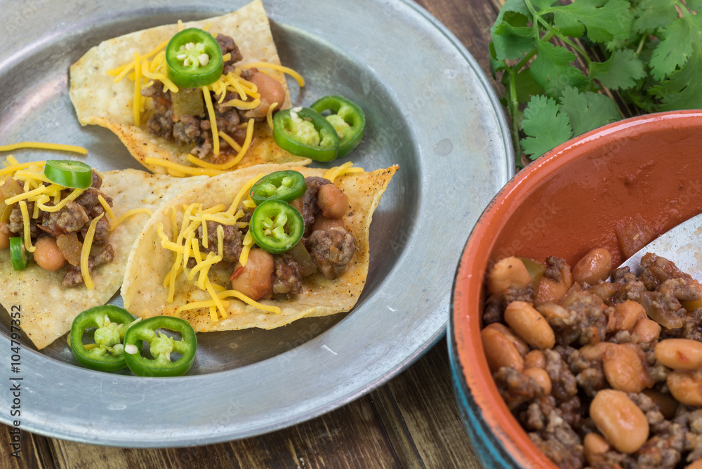 Homemade nachos with beef and pinto beans - ready to bake. Homemade nachos with beef and pinto beans - ready to bake.