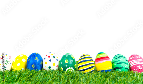 Easter Eggs on Fresh Green Grass over white background