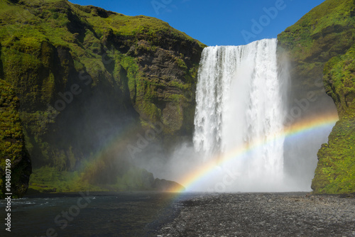 Skogafoss waterfall with double rainbow at perfect sunny day, Iceland