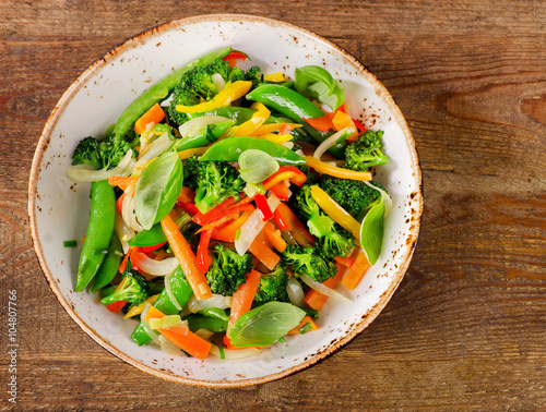 Photos Vegetable stir fry in a plate.