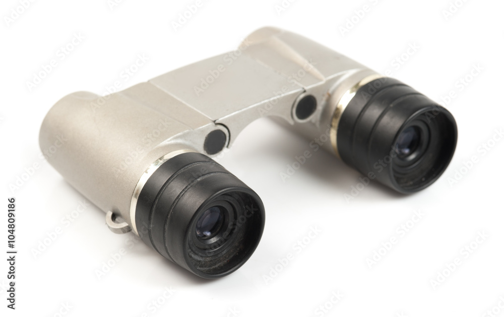 binocular lying on a white binocular lying on a white