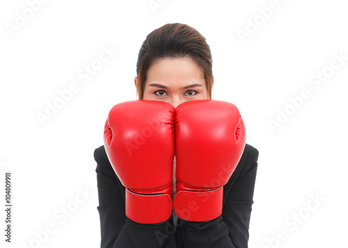 Asian business woman with boxing gloves in guard position isolat