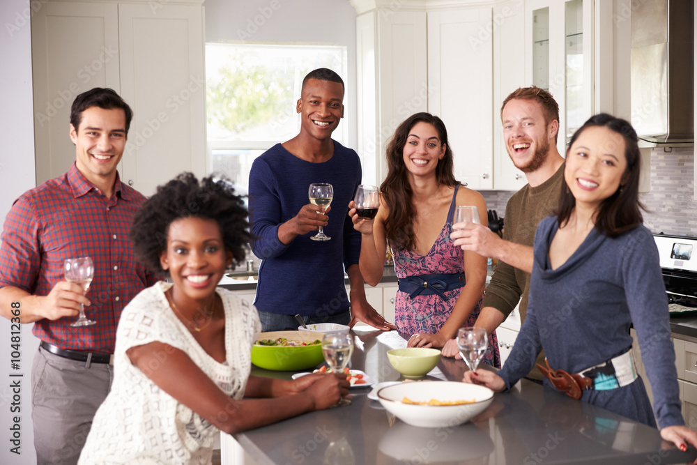 Portrait Of Friends Enjoying Pre Dinner Drinks At Home Portrait Of Friends Enjoying Pre Dinner Drinks At Home