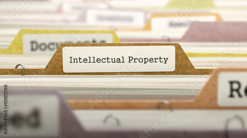 Intellectual Property on Business Folder in Multicolor Card Index. Closeup View. Blurred Image. 3D Render.