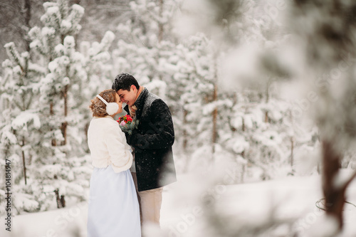 couple in a pine forest