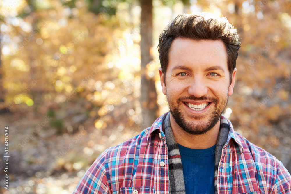 Head And Shoulders Portrait Of Man In Autumn Woodland