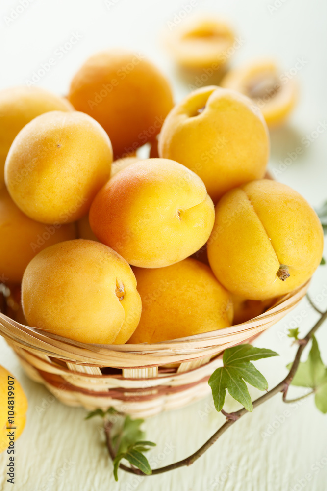 Fresh apricots in rustic basket