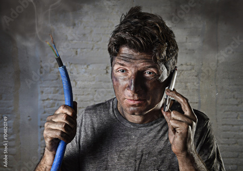 young man calling for help after accident with dirty burnt face in funny sad expression