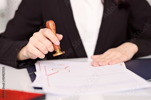 Obraz na płótnie Notary Public woman hands stamping notary act . w salonie