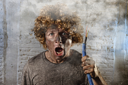 Cuadro en lienzo man with cable smoking after domestic accident with dirty burnt face shock elect