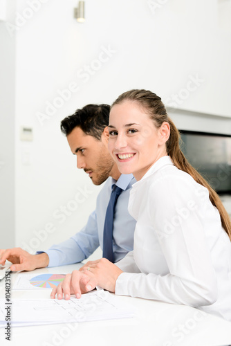 business people man and woman working together with a laptop computer in office