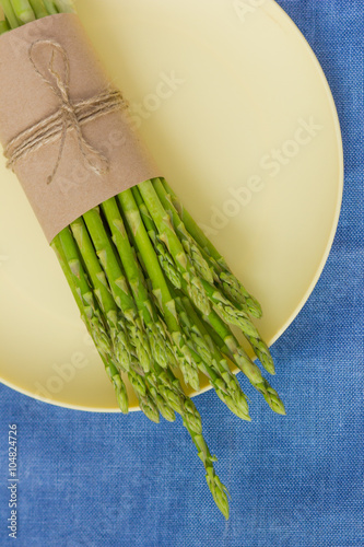 Fresh green asparagus on a plate