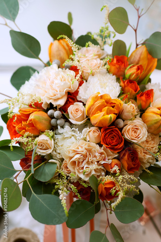 Spring flowers. Orange bouquet with carnations, tulips, roses 