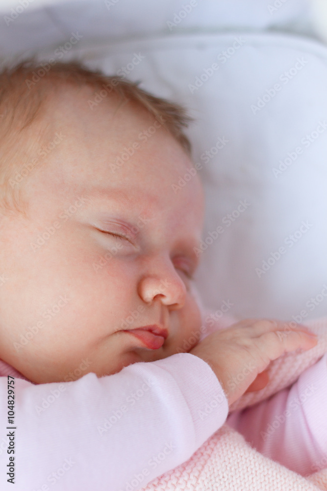 Newborn baby girl sleeping/Cute newborn baby girl sleeping in a cradle Newborn baby girl sleeping/Cute newborn baby girl sleeping in a cradle