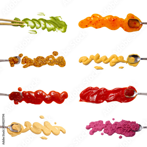 Set of 8 savory sauces and dips isolated on white. Spoons dipped in the sauces. Wasabi, mustard, salsa, mayonnaise, sweet and sour sauce, cheese sauce, ketchup, horseradish red sauce. photo