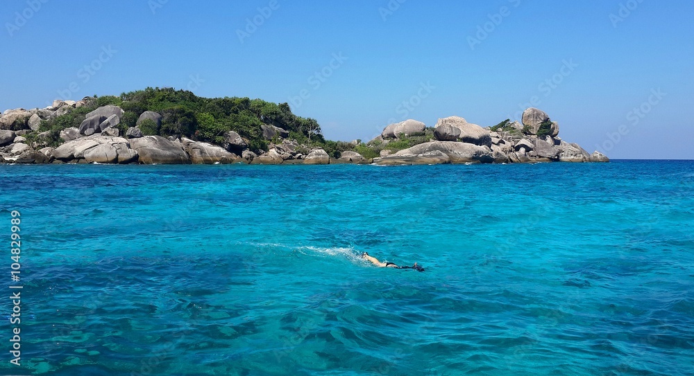 Woman enjoy snorkeling with clear water at Lipe island, Thailand