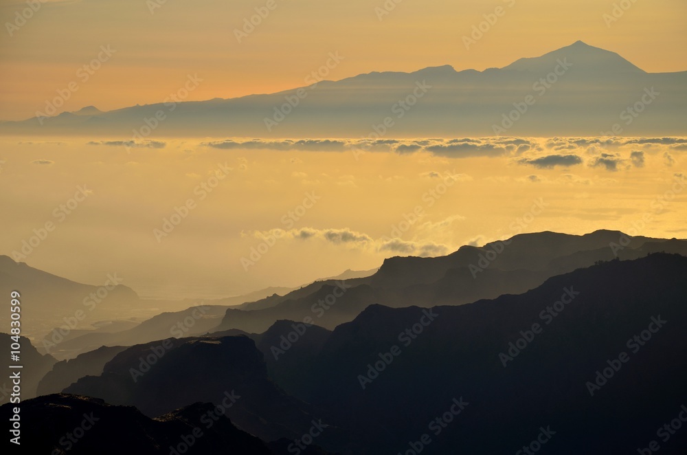 Silhouettes of mountains and Tenerife island in background, Canary islands Silhouettes of mountains and Tenerife island in background, Canary islands