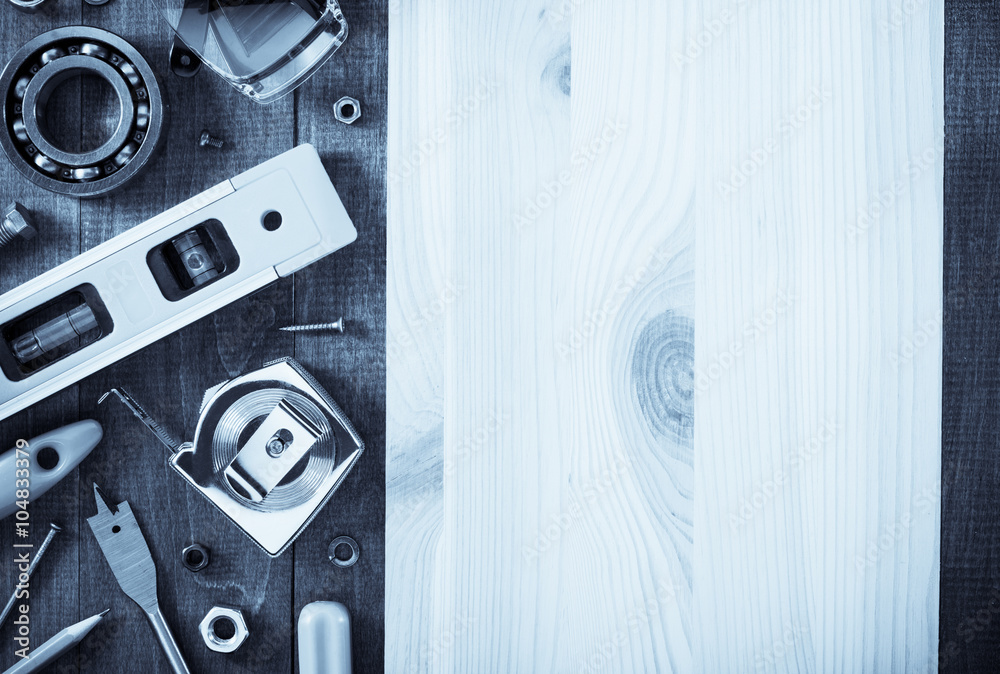 Obraz premium work tools and instruments on wood