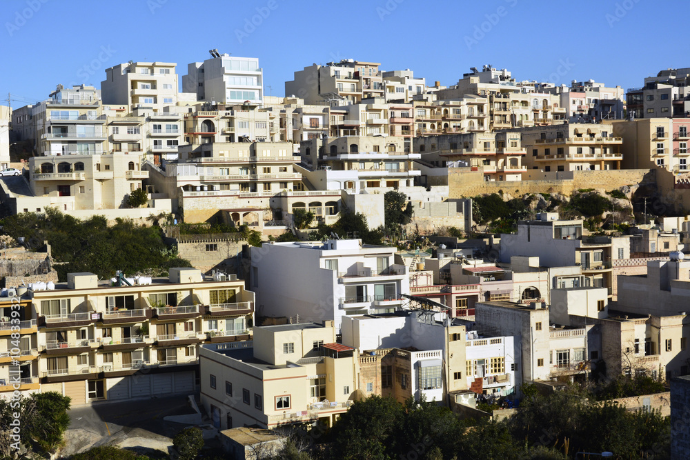 View of residential buildings in Mellieha, Malta.