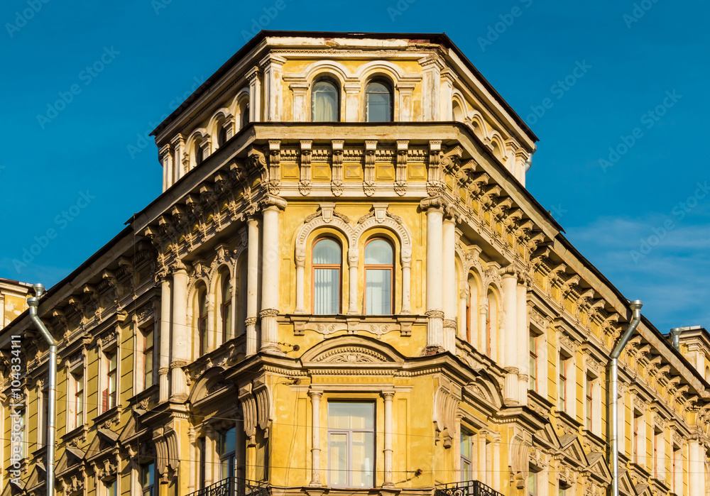 Corner of old apartment building facade in St. Petersburg, Russia.