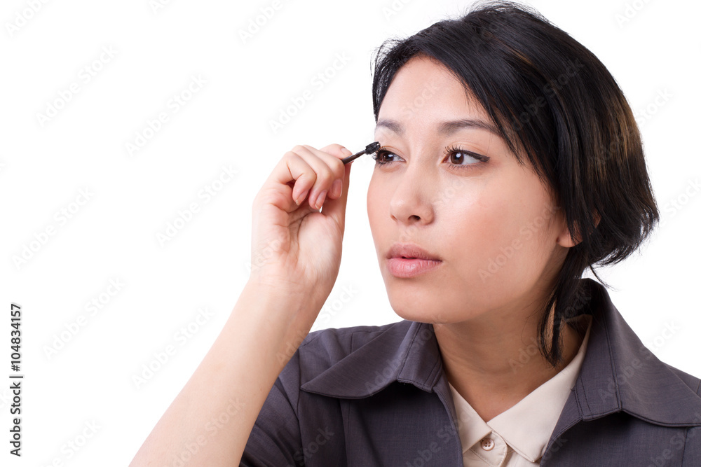 business woman's grooming, making up, looking up to blank space business woman's grooming, making up, looking up to blank space