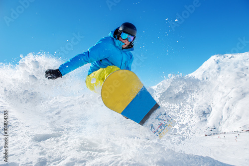 Active snowboarder jumping