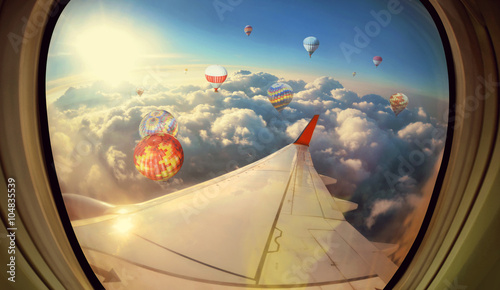 Clouds  sky and Balloons as seen through window of an aircraft