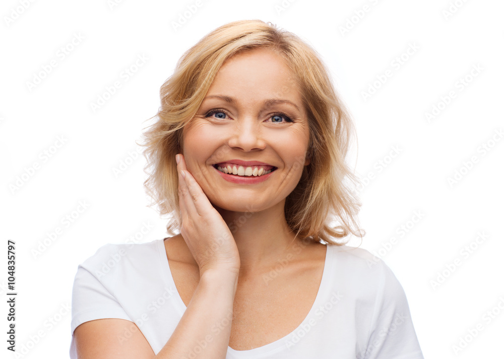 smiling woman in white t-shirt touching her face smiling woman in white t-shirt touching her face