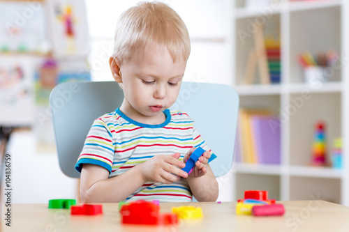 Child boy learning to use c...