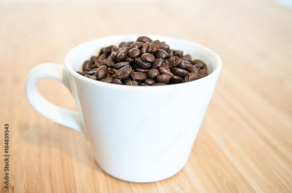 coffee beans in a mug coffee beans in a mug