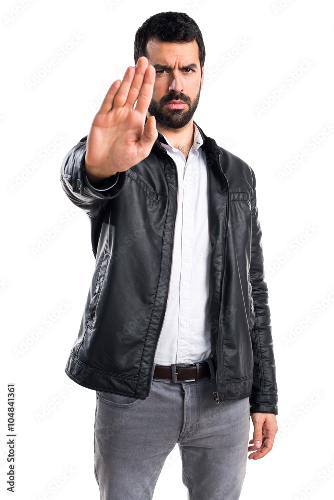 Man with leather jacket making stop sign Man with leather jacket making stop sign