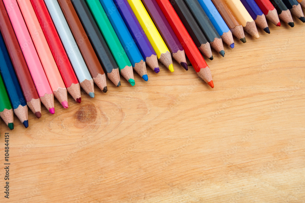 Closed up color pencil with wooden background Closed up color pencil with wooden background