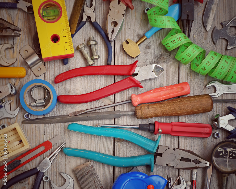 Tools on a wooden floor, top view. Tools on a wooden floor, top view.