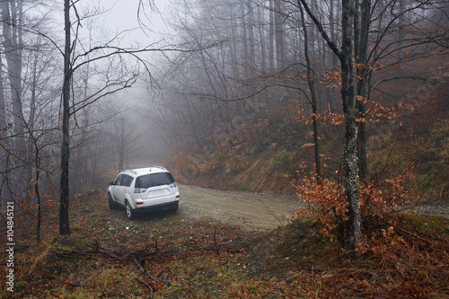 SUV offroad on a foggy day
