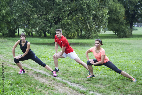 Young people stretching in ...