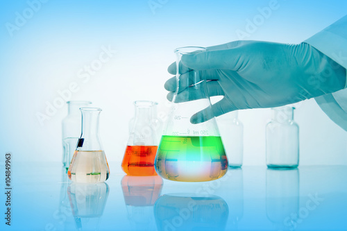 Flask in scientist hand