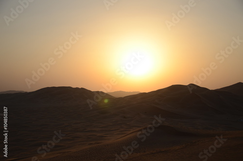 Sun over sand dunes Shara desert