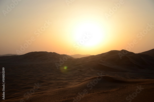 Sun over sand dunes Shara desert