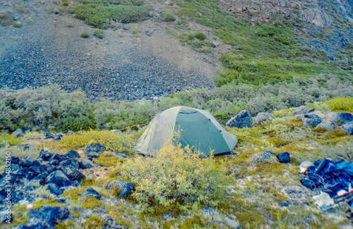 Tent pitched near a small river in the Wrangell-St. Elias Nation