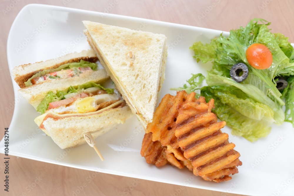 Freshly made club sandwiches served with potato chips Freshly made club sandwiches served with potato chips