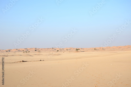 Wide plane and sand floor and dunes in Oman